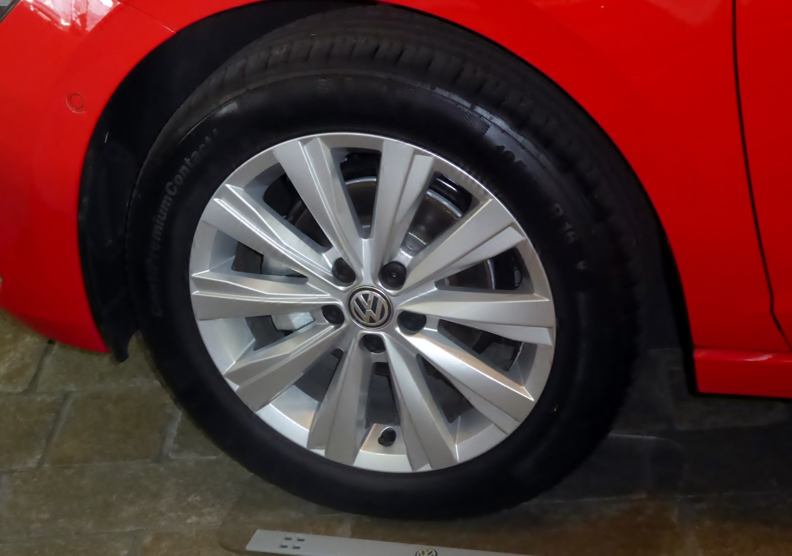 Tyre and alloy wheel on a red Volkswagen Polo