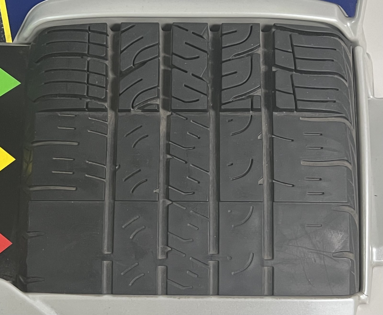 Goodyear tyre tread showing small wear bars within the grooves