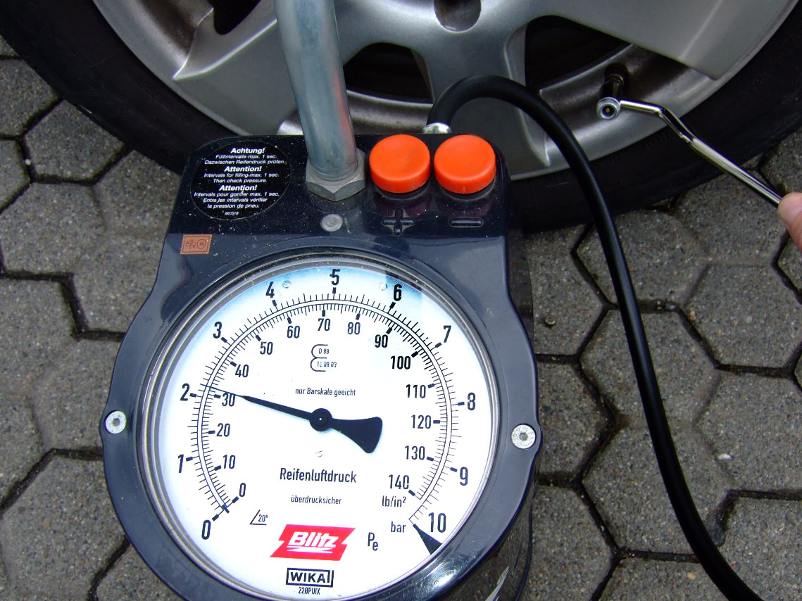 Pressure gauge attached to a car tyre valve