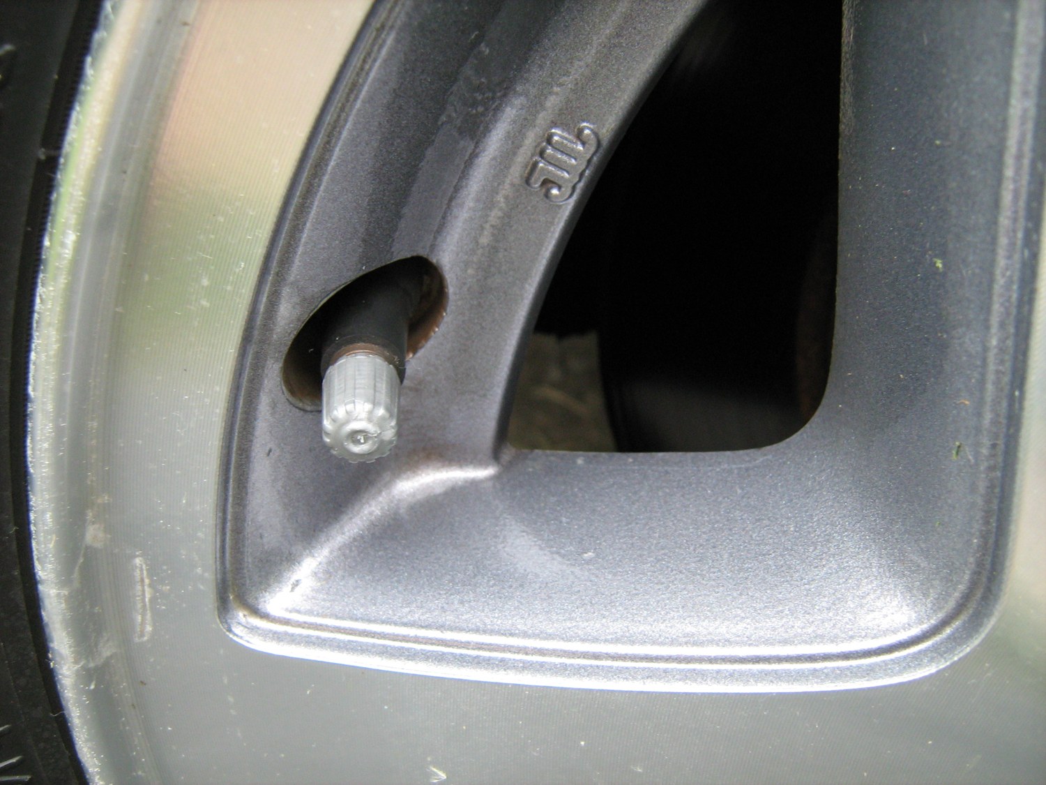 Capped valve on a car wheel
