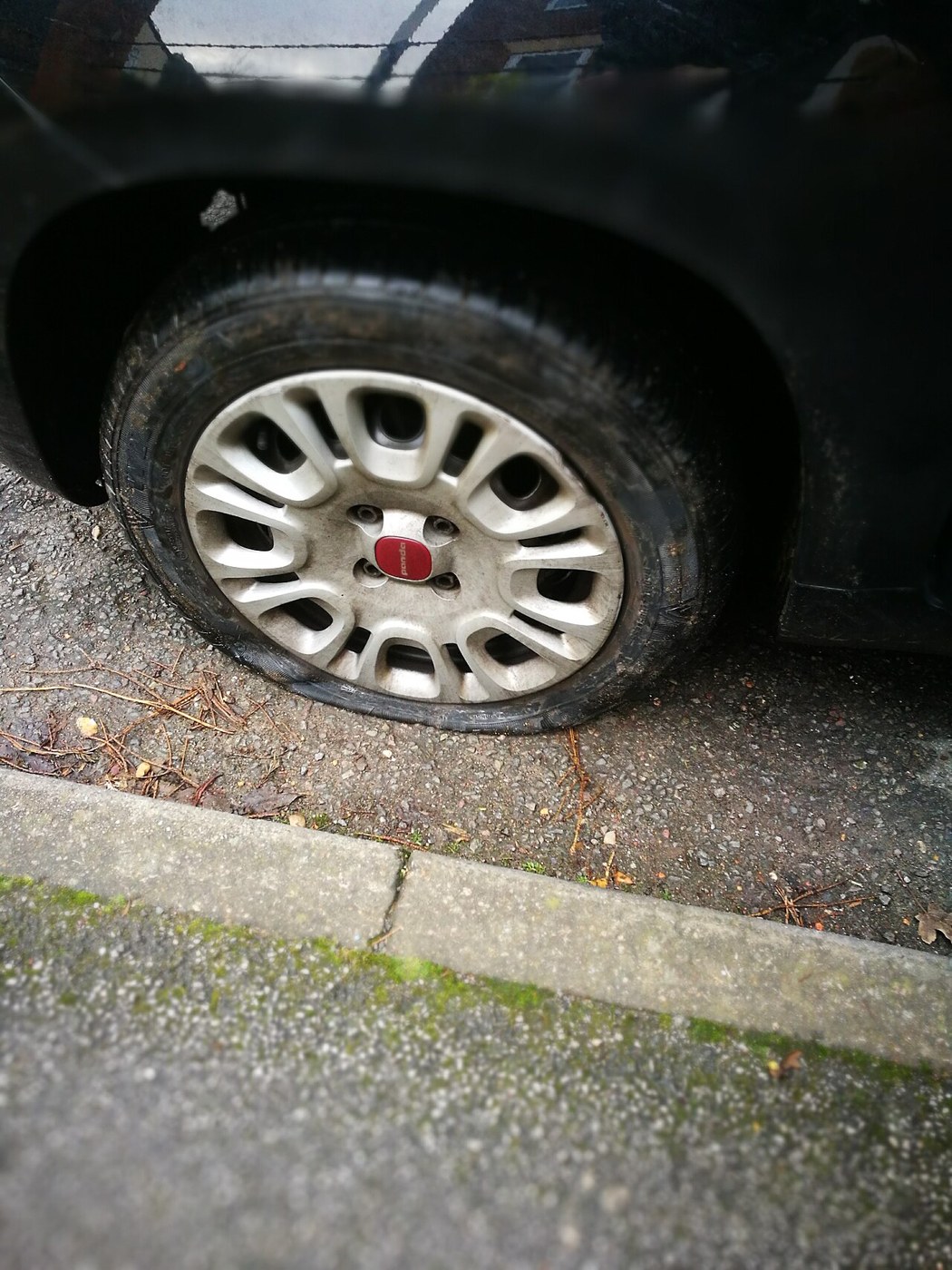 Visibly deflated tyre on a Fiat Panda