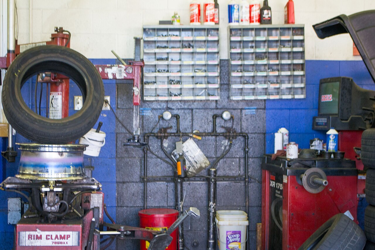 Tyre fitting machine and tools inside a workshop