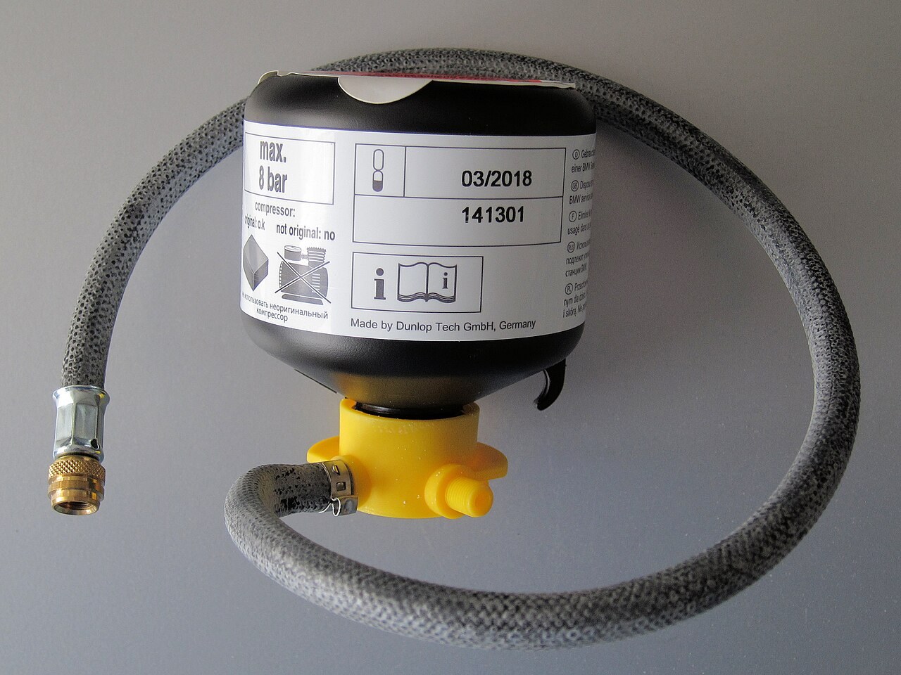 Sealant container and hose from a puncture system